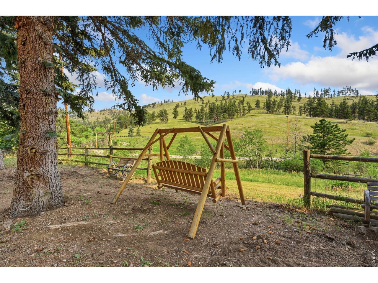 12743 Rist Canyon Road Bellvue, CO 80512 - Photo 5 of 49 a view of a lake with a play ground