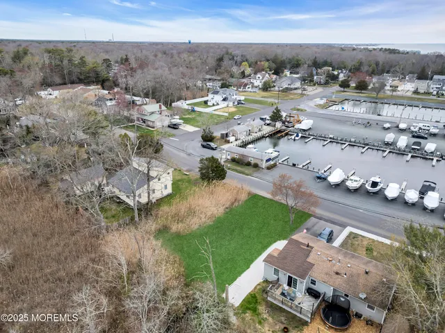 a view of a town with big trees