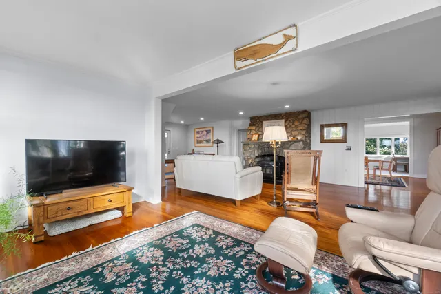 a bedroom with bed and wooden floor