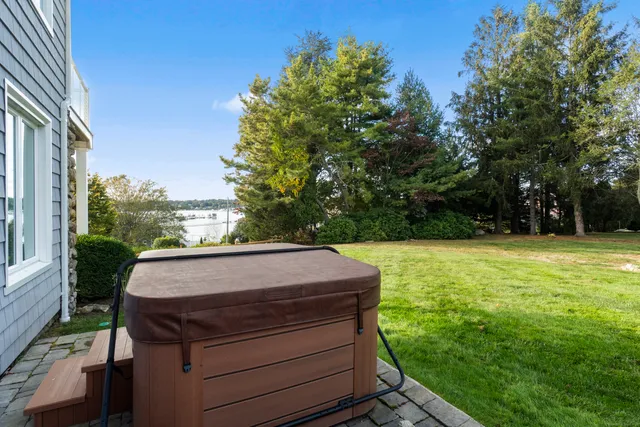 a view of a dining room with furniture wooden floor and chandelier