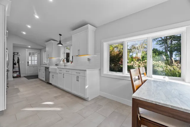 a view of a kitchen with furniture and windows