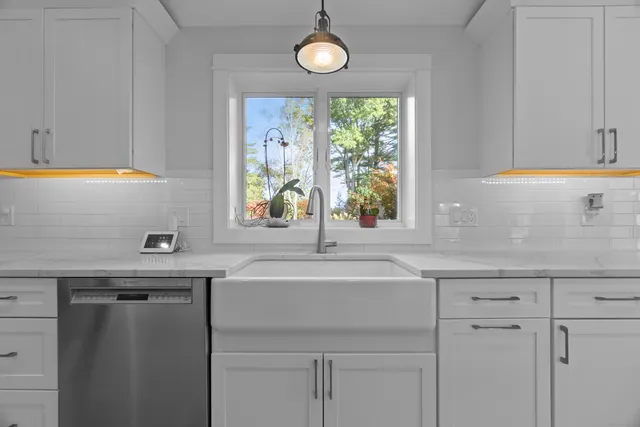 a kitchen with a sink and a window