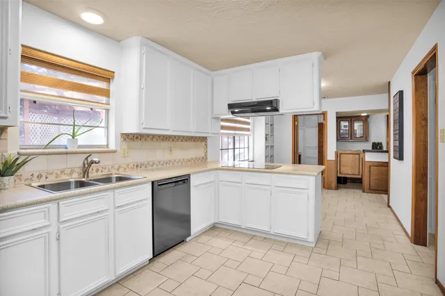 a kitchen with appliances cabinets and a sink
