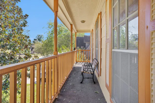 a view of a balcony with wooden floor