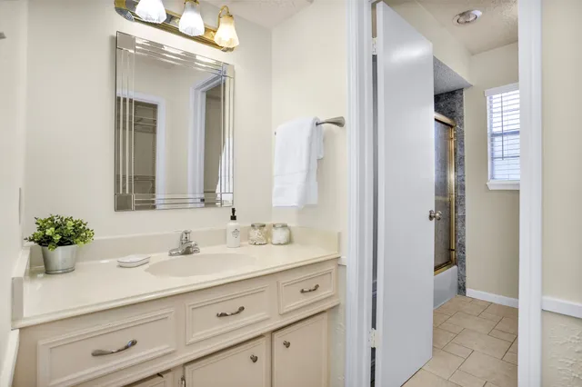 a bathroom with a sink double vanity and a mirror