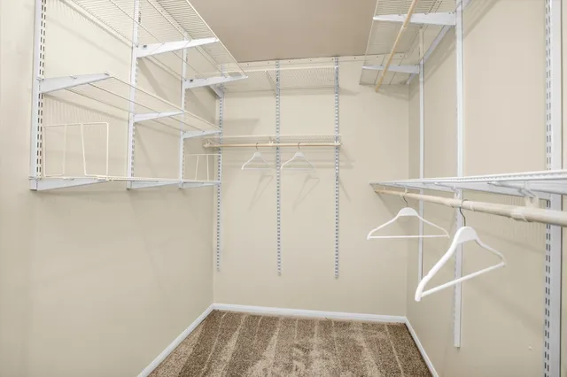 a workspace with wooden floor and a window