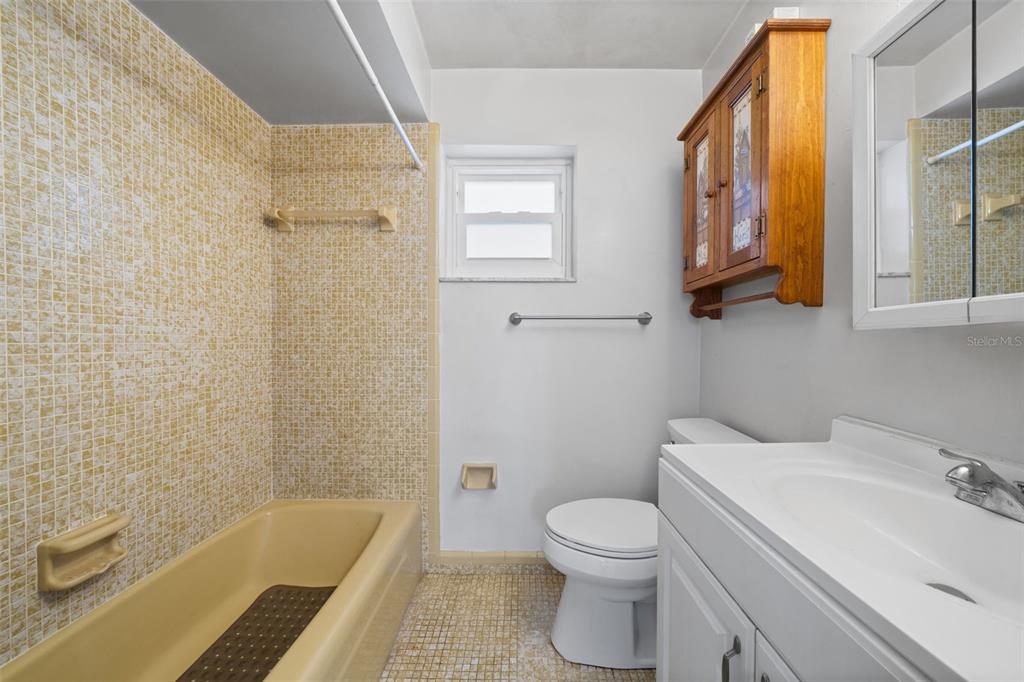 1540 Northwest 10th Street Boca Raton, FL 33486 - Photo 20 of 38 a bathroom with a sink a toilet and bathtub