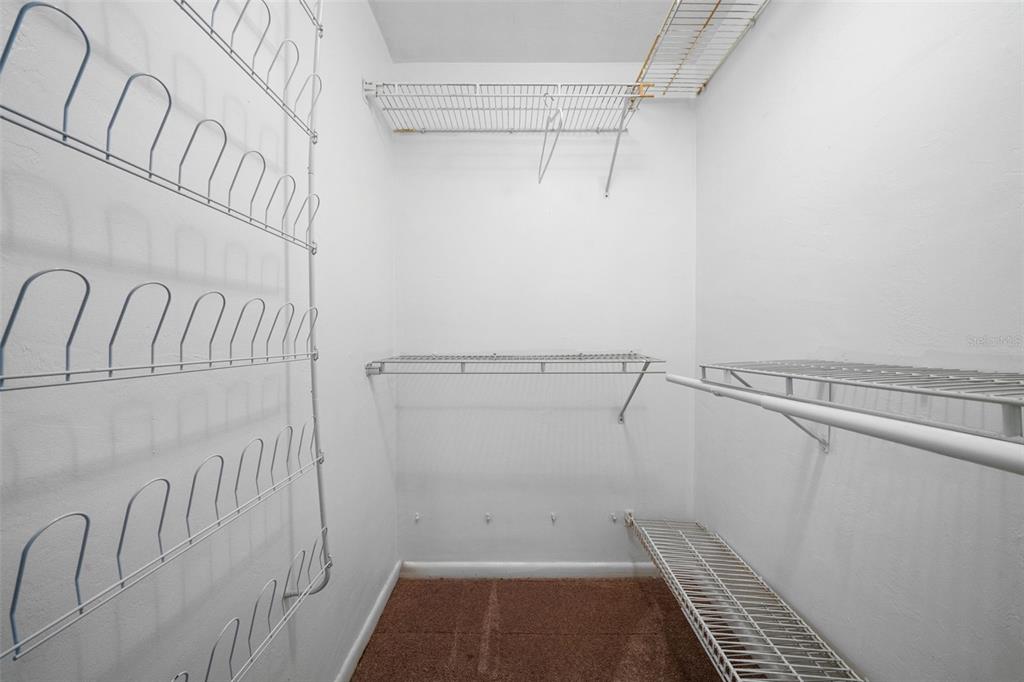 1540 Northwest 10th Street Boca Raton, FL 33486 - Photo 21 of 38 a view of a room with racks on the wall