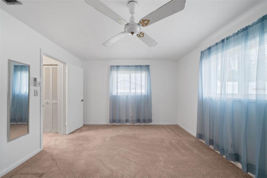 1540 Northwest 10th Street Boca Raton, FL 33486 - Photo 24 of 38 an empty room with fan and windows