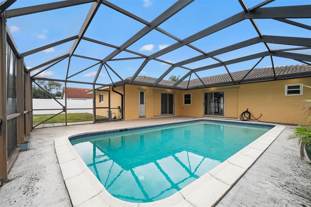 1540 Northwest 10th Street Boca Raton, FL 33486 - Photo 29 of 38 a view of a swimming pool with a patio