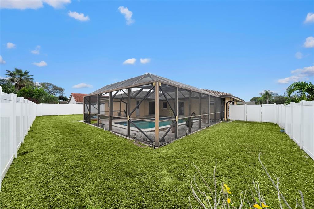 1540 Northwest 10th Street Boca Raton, FL 33486 - Photo 31 of 38 a view of a tiny house with backyard and garden