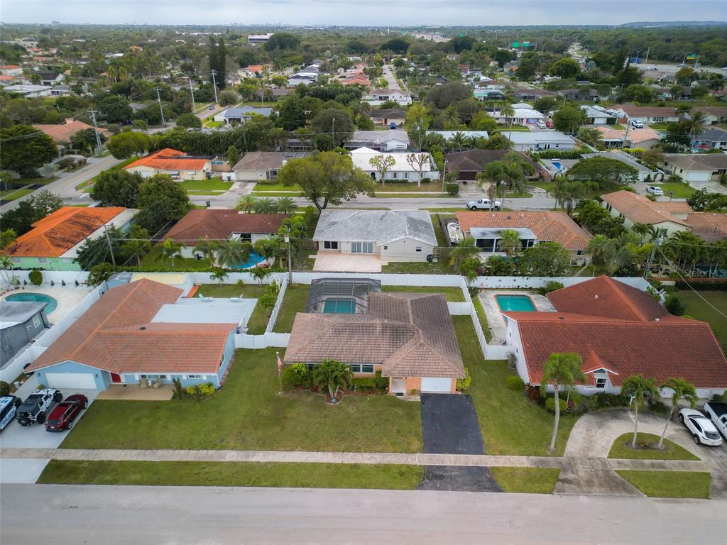 1540 Northwest 10th Street Boca Raton, FL 33486 - Photo 32 of 38 an aerial view of a house with yard swimming pool and ocean view