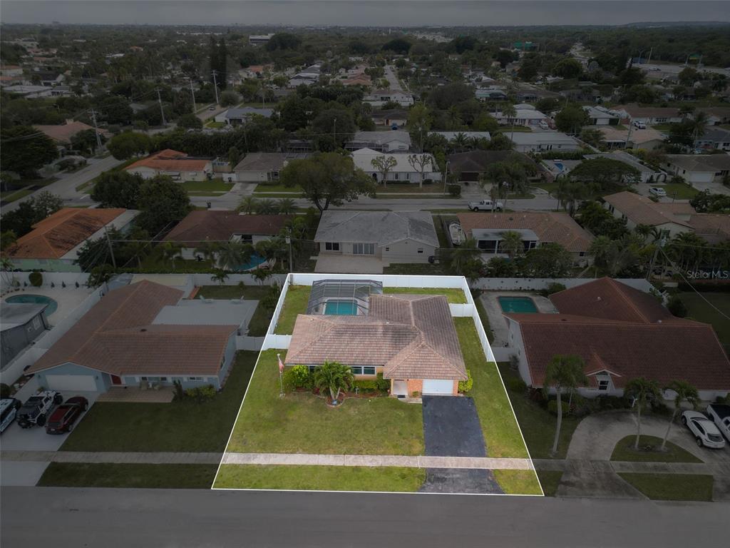 1540 Northwest 10th Street Boca Raton, FL 33486 - Photo 35 of 38 an aerial view of a house with swimming pool outdoor seating and yard