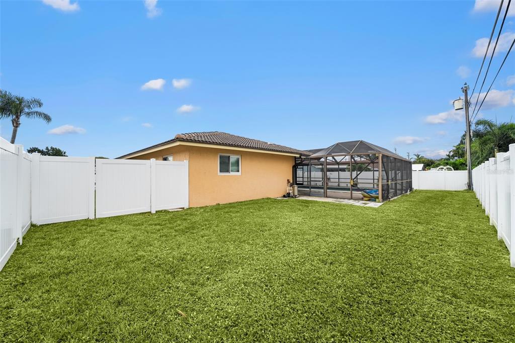 1540 Northwest 10th Street Boca Raton, FL 33486 - Photo 5 of 38 a backyard of a house with lots of green space