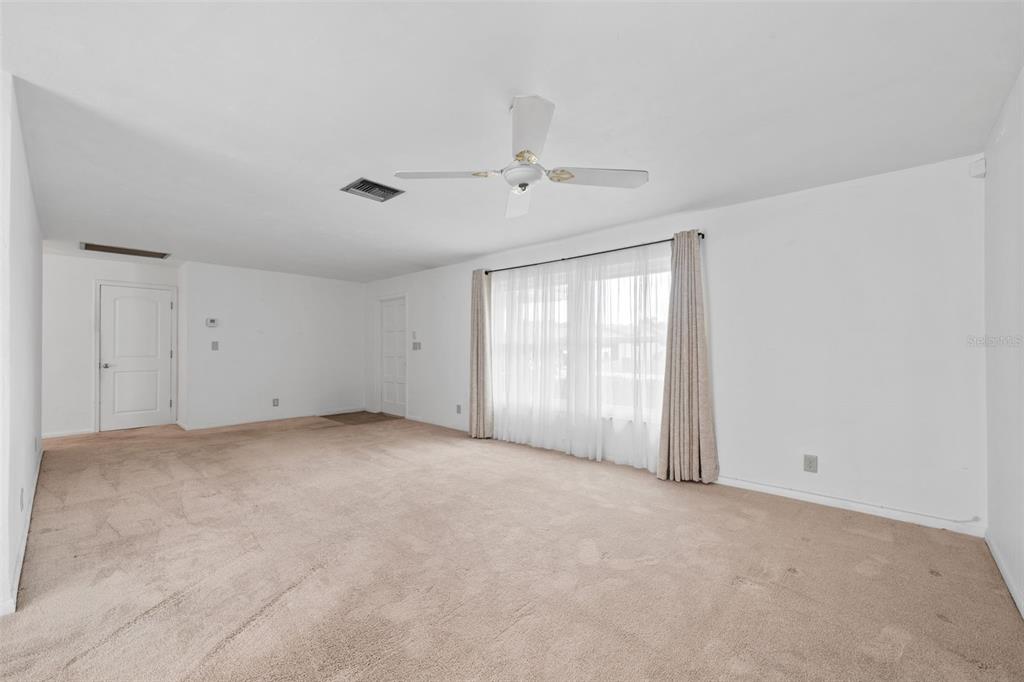 1540 Northwest 10th Street Boca Raton, FL 33486 - Photo 9 of 38 a view of an empty room with a window