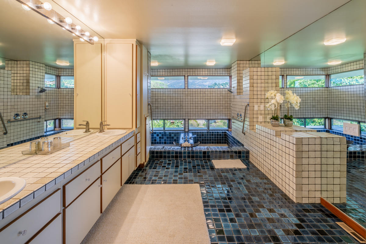 350 Las Alturas Road Santa Barbara, CA 93103 - Photo 13 of 49 a bathroom with a sink a mirror and shower