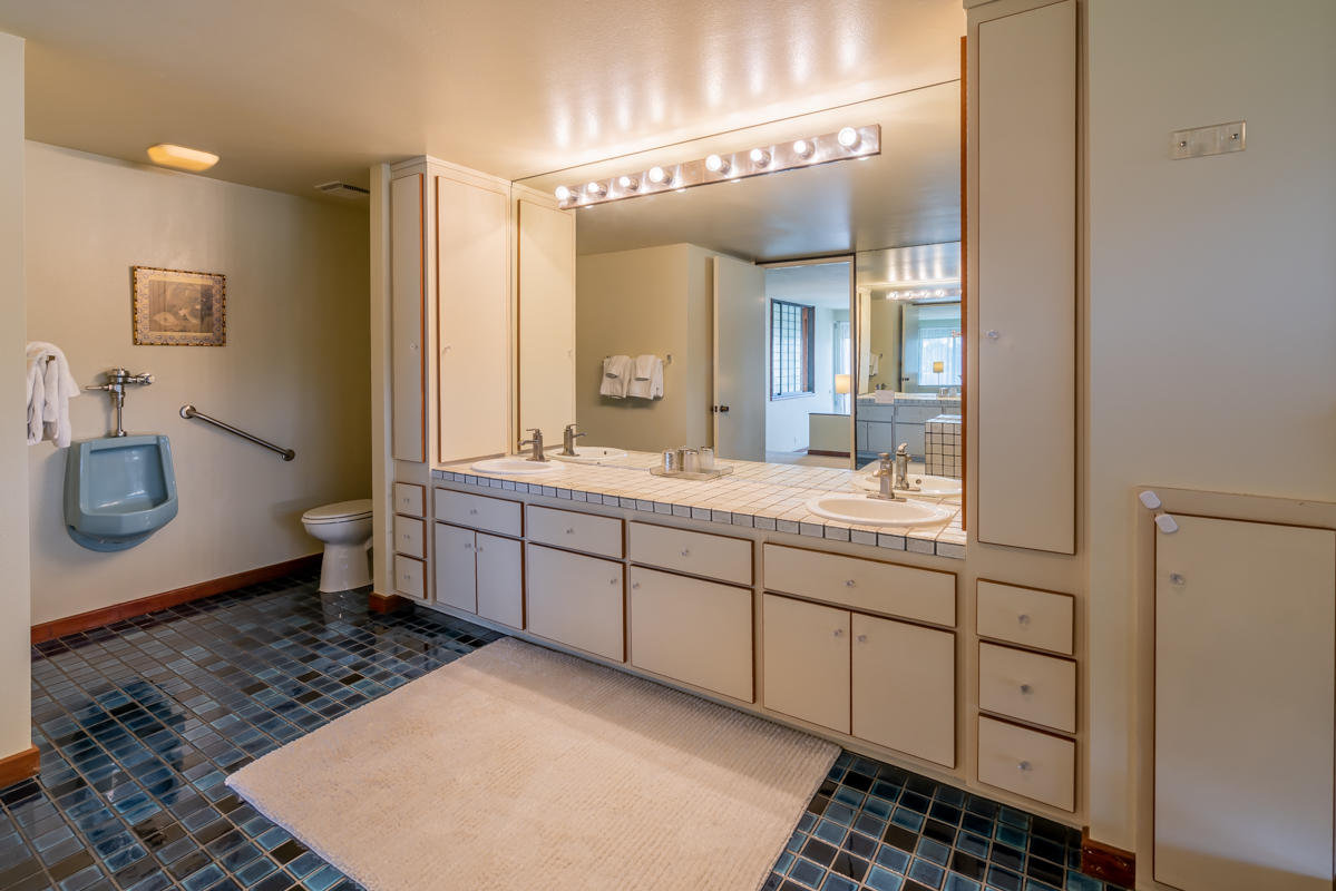 350 Las Alturas Road Santa Barbara, CA 93103 - Photo 14 of 49 a spacious bathroom with a double vanity sink a toilet and a mirror