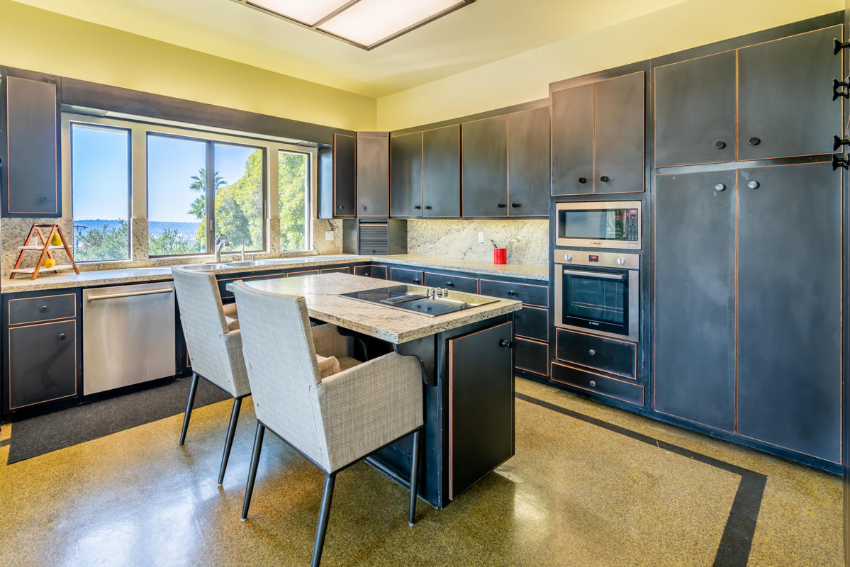 350 Las Alturas Road Santa Barbara, CA 93103 - Photo 20 of 49 a kitchen that has a table and chairs in it
