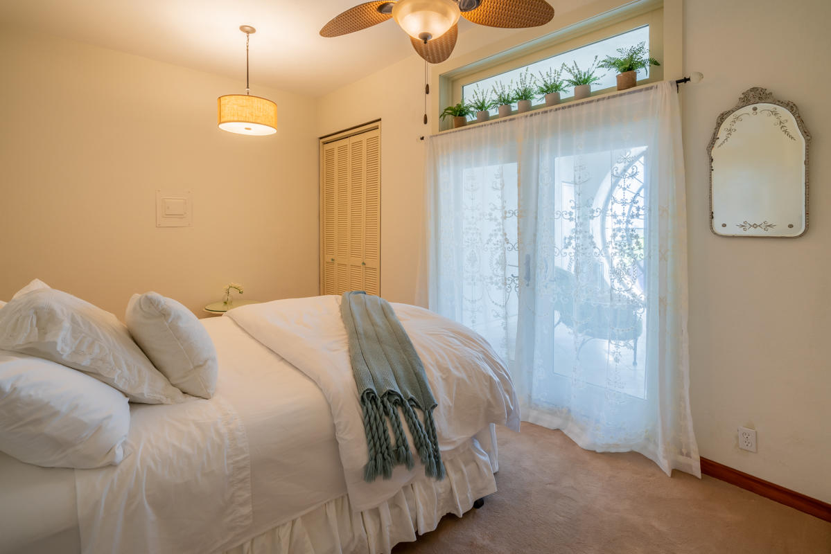 350 Las Alturas Road Santa Barbara, CA 93103 - Photo 28 of 49 a bedroom with a bed and a mirror