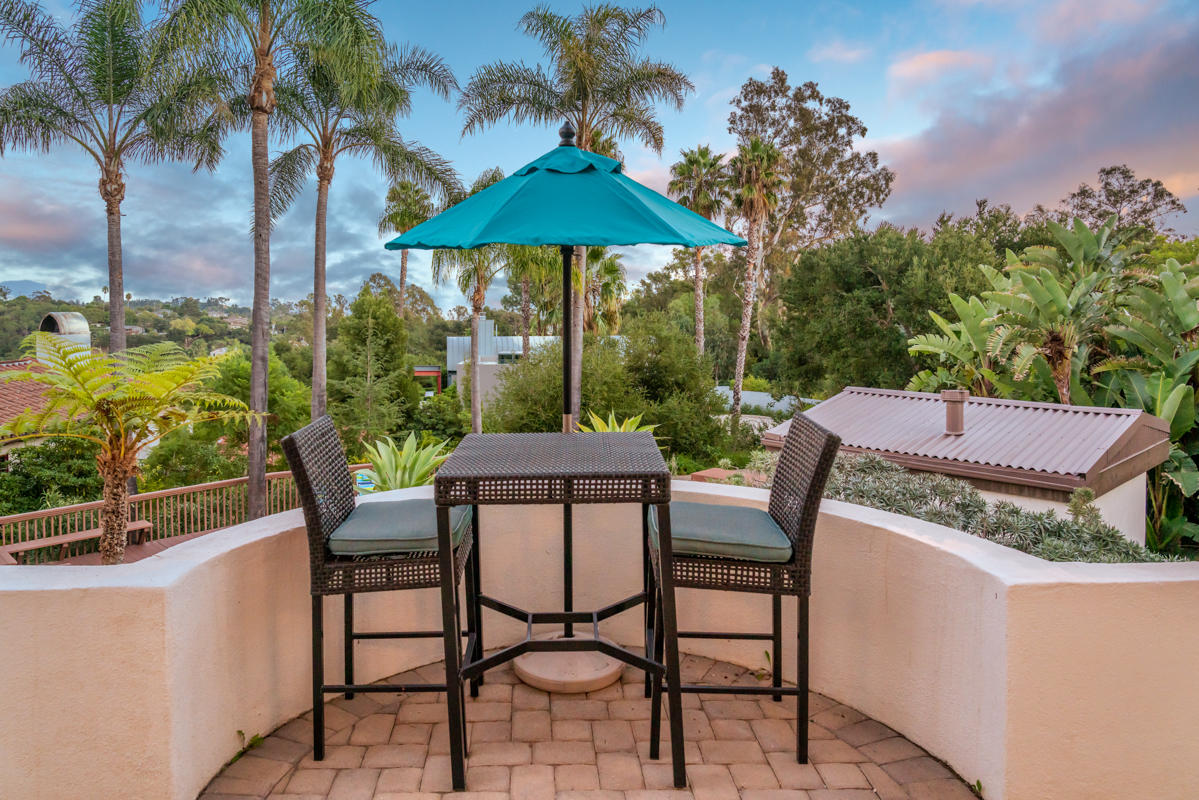 350 Las Alturas Road Santa Barbara, CA 93103 - Photo 32 of 49 a view of a patio with furniture and a yard
