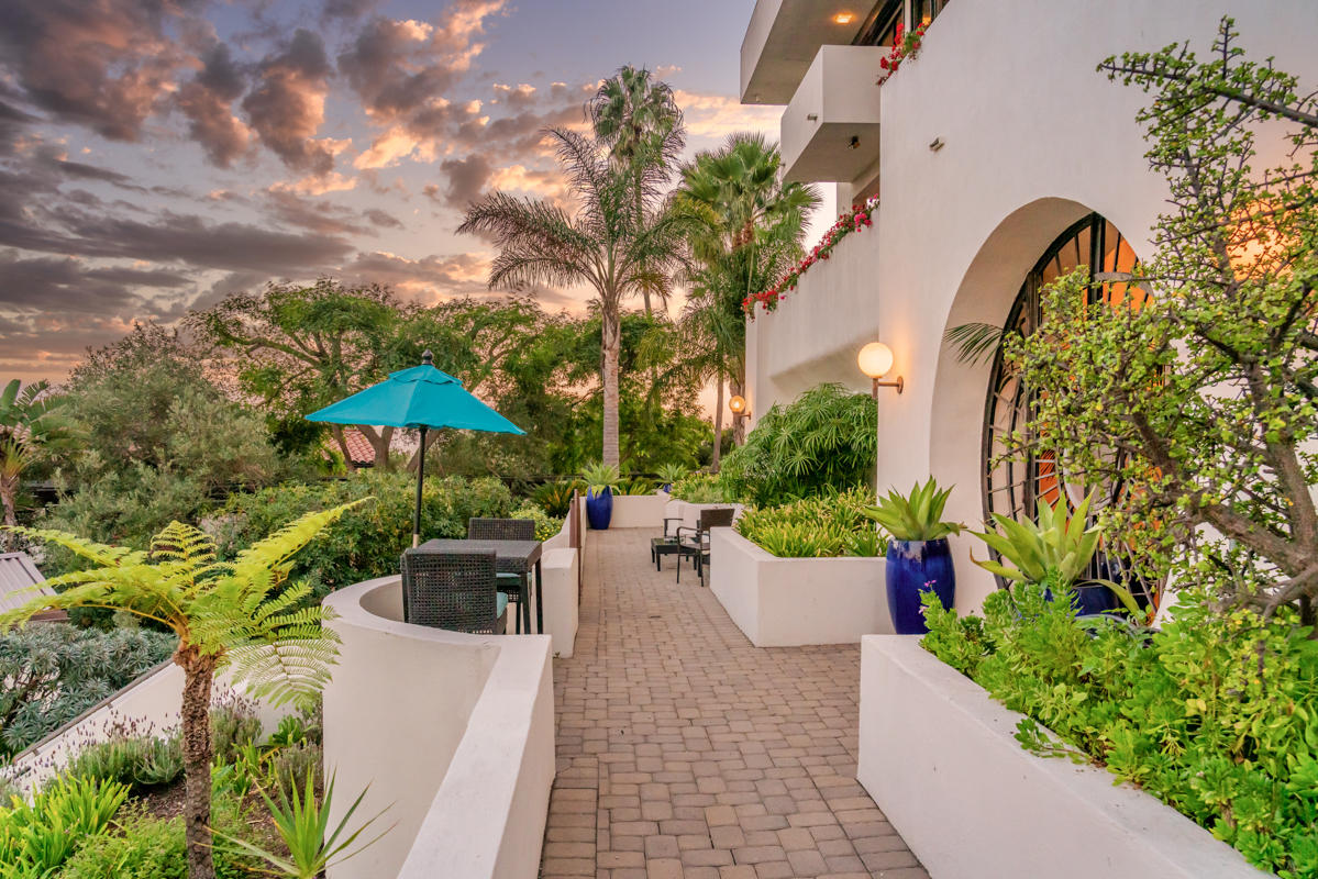 350 Las Alturas Road Santa Barbara, CA 93103 - Photo 33 of 49 a view of a chair and table in the patio
