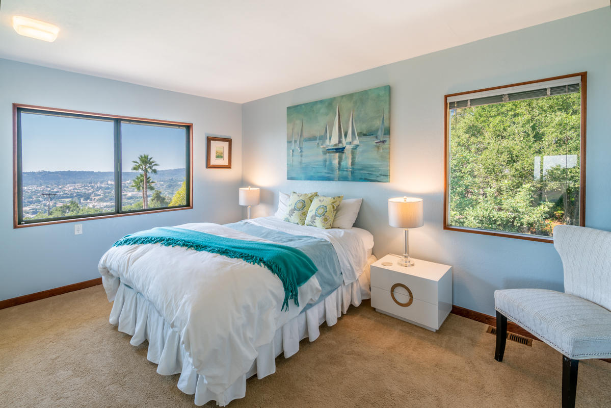 350 Las Alturas Road Santa Barbara, CA 93103 - Photo 10 of 49 a bedroom with a bed and a painting on the wall
