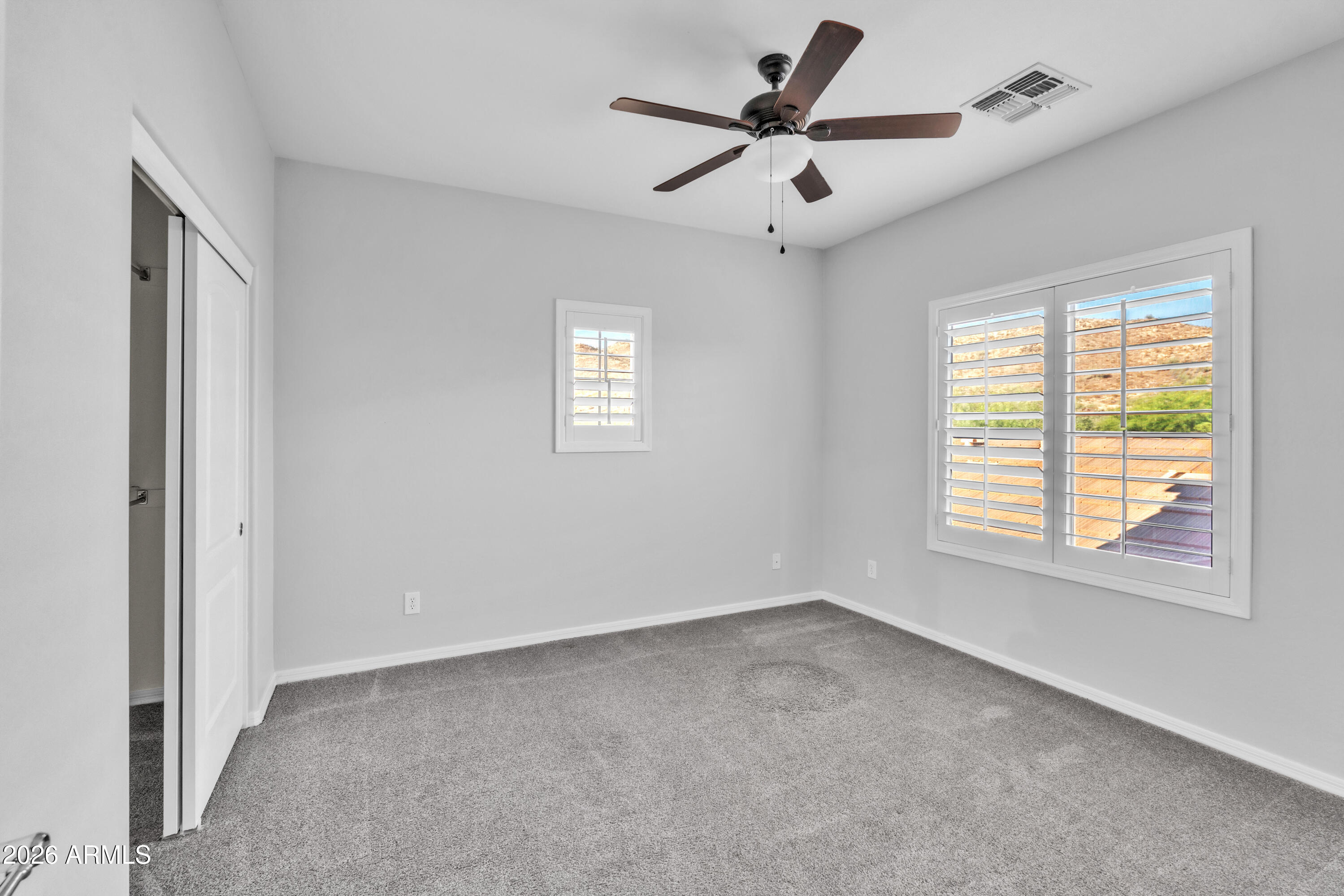 1615 West Red Fox Road Phoenix, AZ 85085 - Photo 42 of 64 a view of a livingroom with a ceiling fan and window