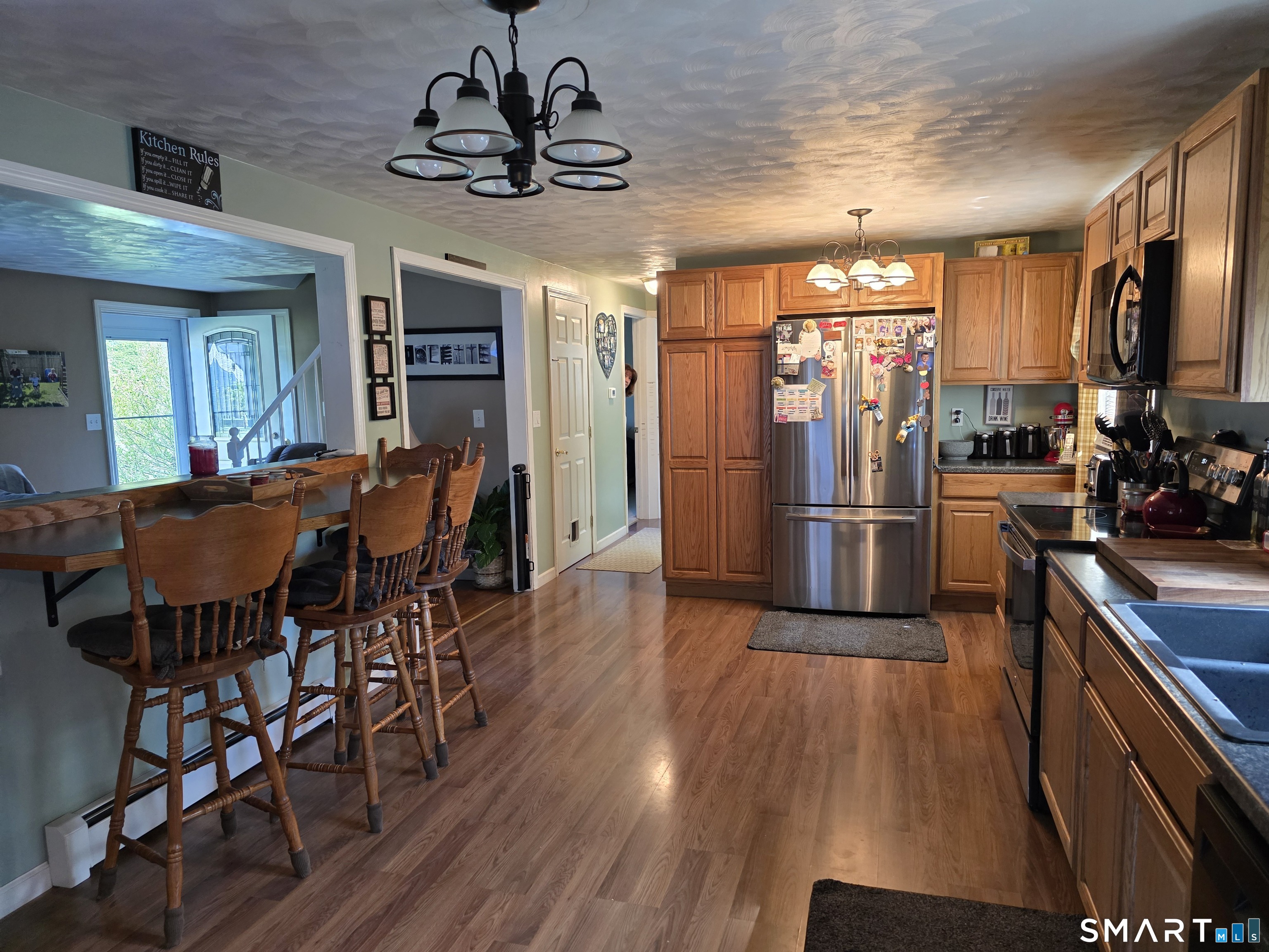 15 Van Buren Road Enfield, CT 06082 - Photo 16 of 40 a view of a dining room with furniture window and wooden floor