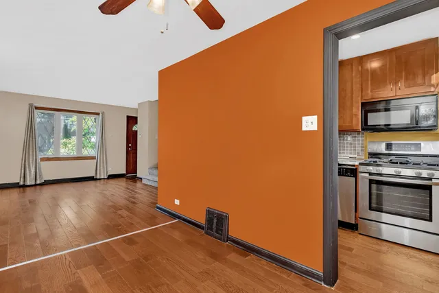 a view of kitchen with window and stainless steel appliances