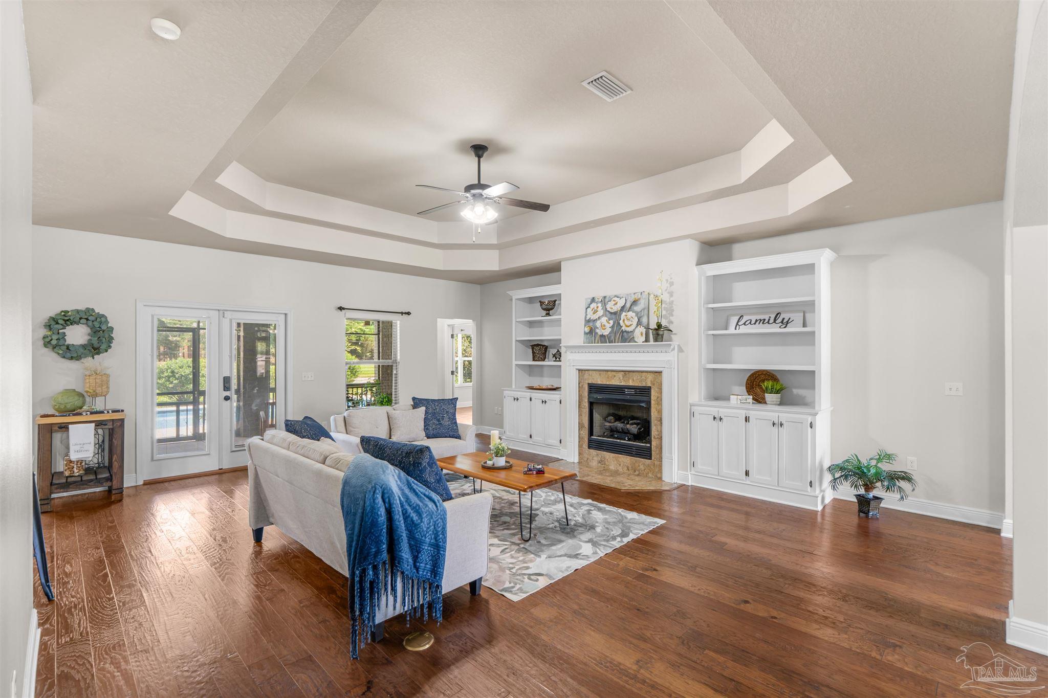 2698 Tulip Hill Road Pace, FL 32571 - Photo 15 of 65 a living room with furniture and a fireplace