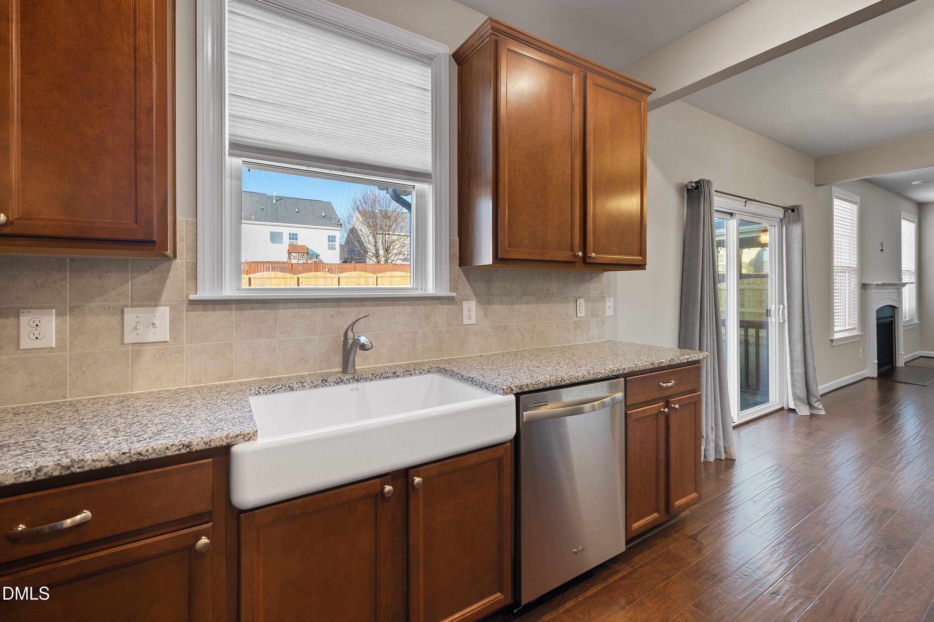721 Maple Brook Road Fuquay-Varina, NC 27526 - Photo 14 of 59 Farmhouse style sink is perfectly positioned to look out over backyard!