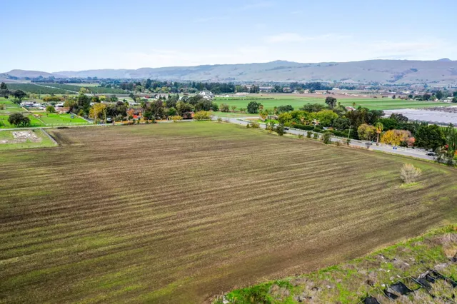 a view of an ocean and a mountain