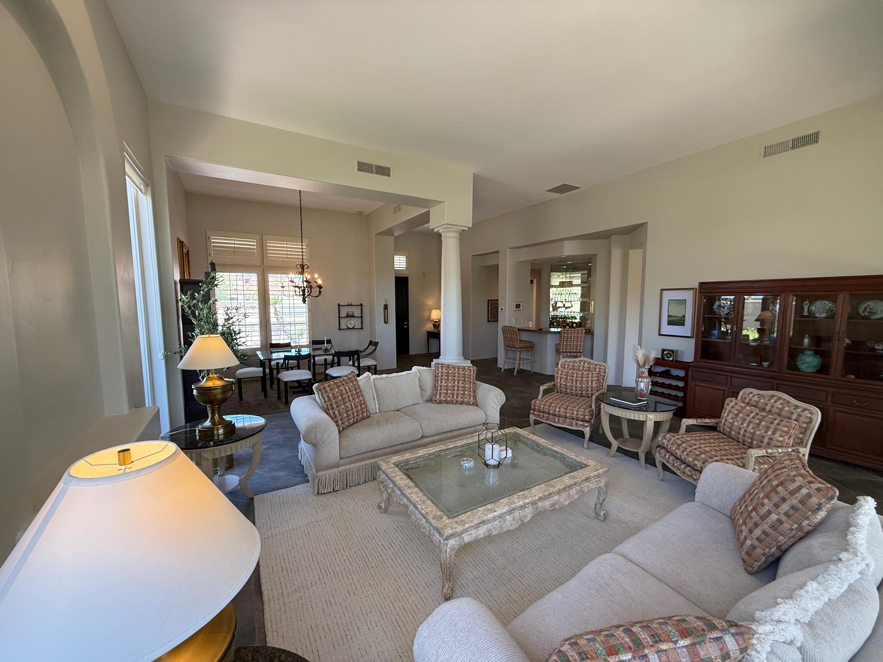 79765 Tangelo La Quinta, CA 92253 - Photo 16 of 55 a living room with furniture and a large window