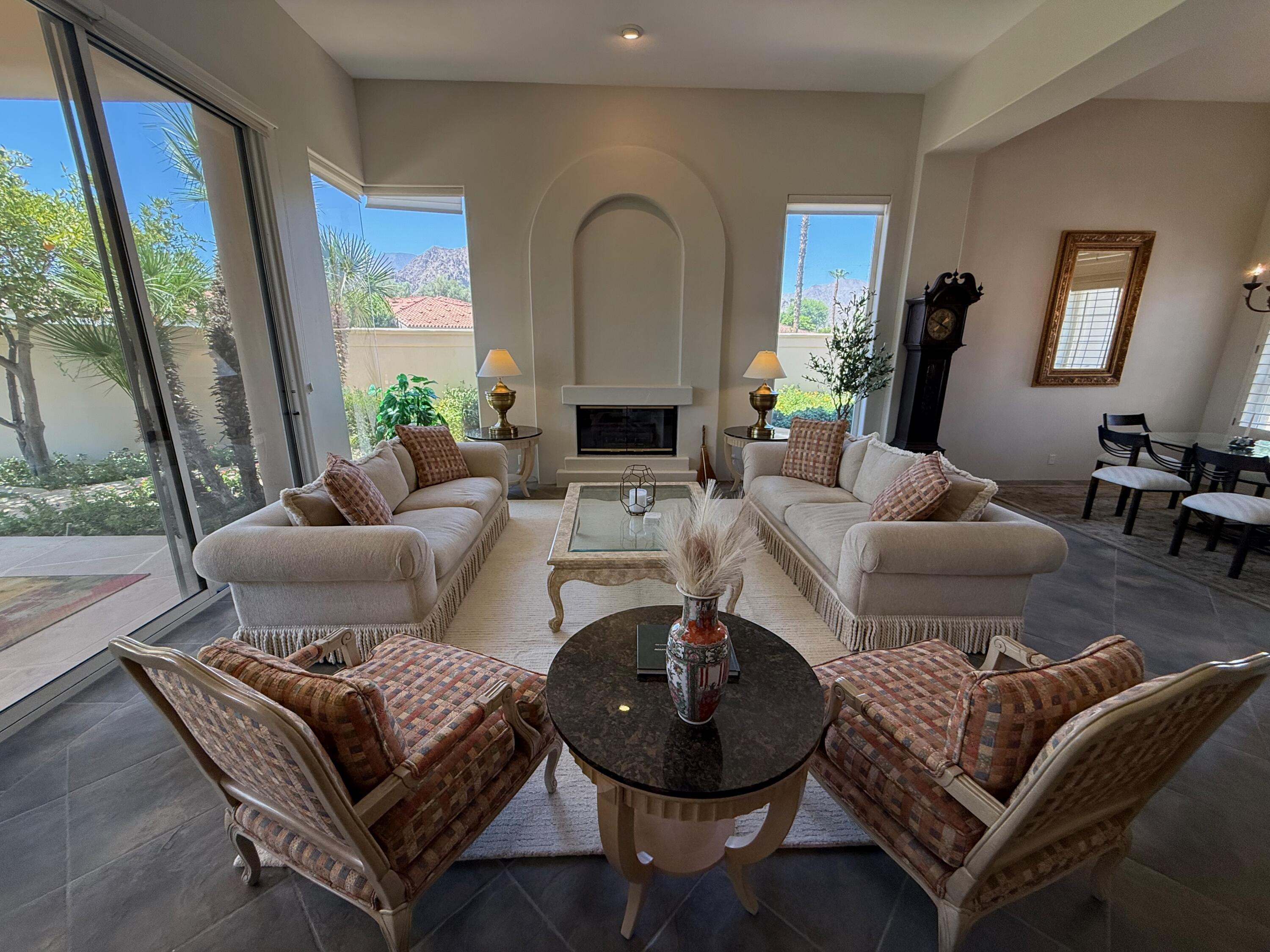 79765 Tangelo La Quinta, CA 92253 - Photo 2 of 55 a living room with furniture and a fireplace