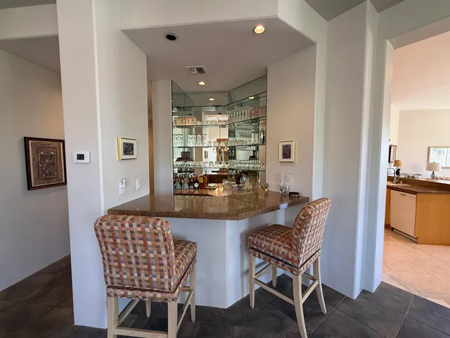 a kitchen with a sink a stove and cabinets