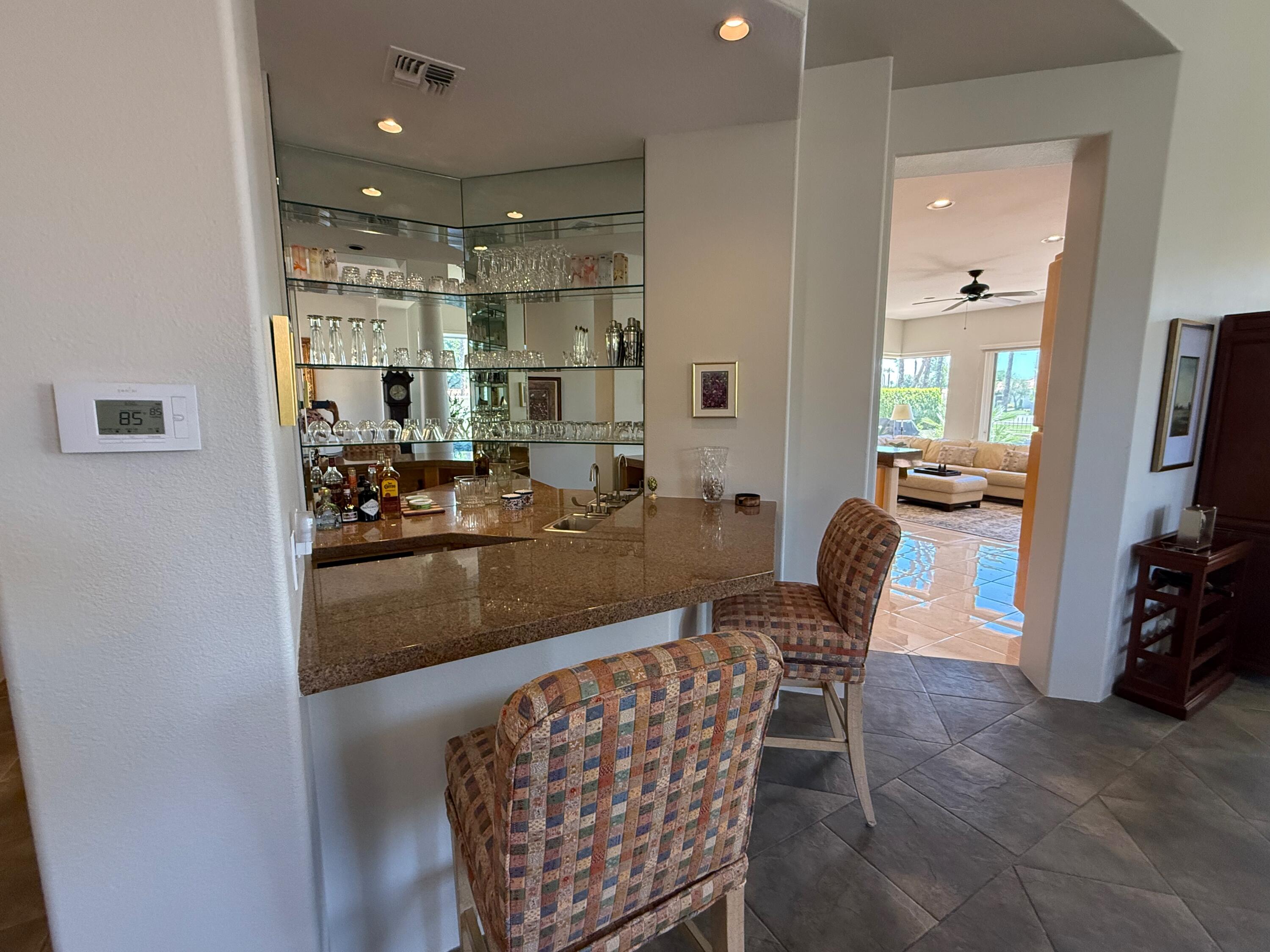 79765 Tangelo La Quinta, CA 92253 - Photo 22 of 55 a view of a dining room with furniture