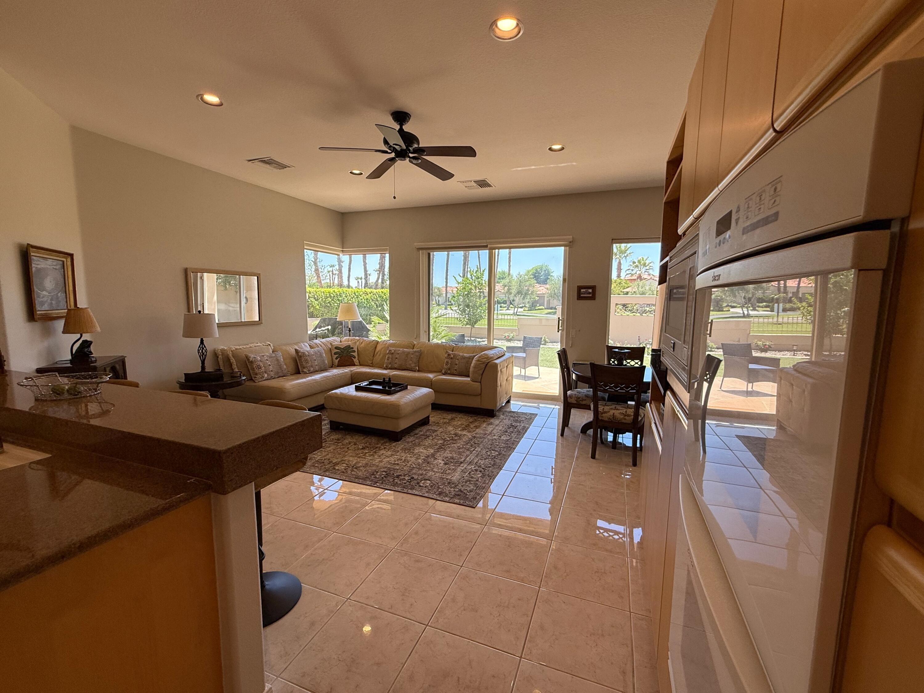 79765 Tangelo La Quinta, CA 92253 - Photo 23 of 55 a living room with furniture and a large window