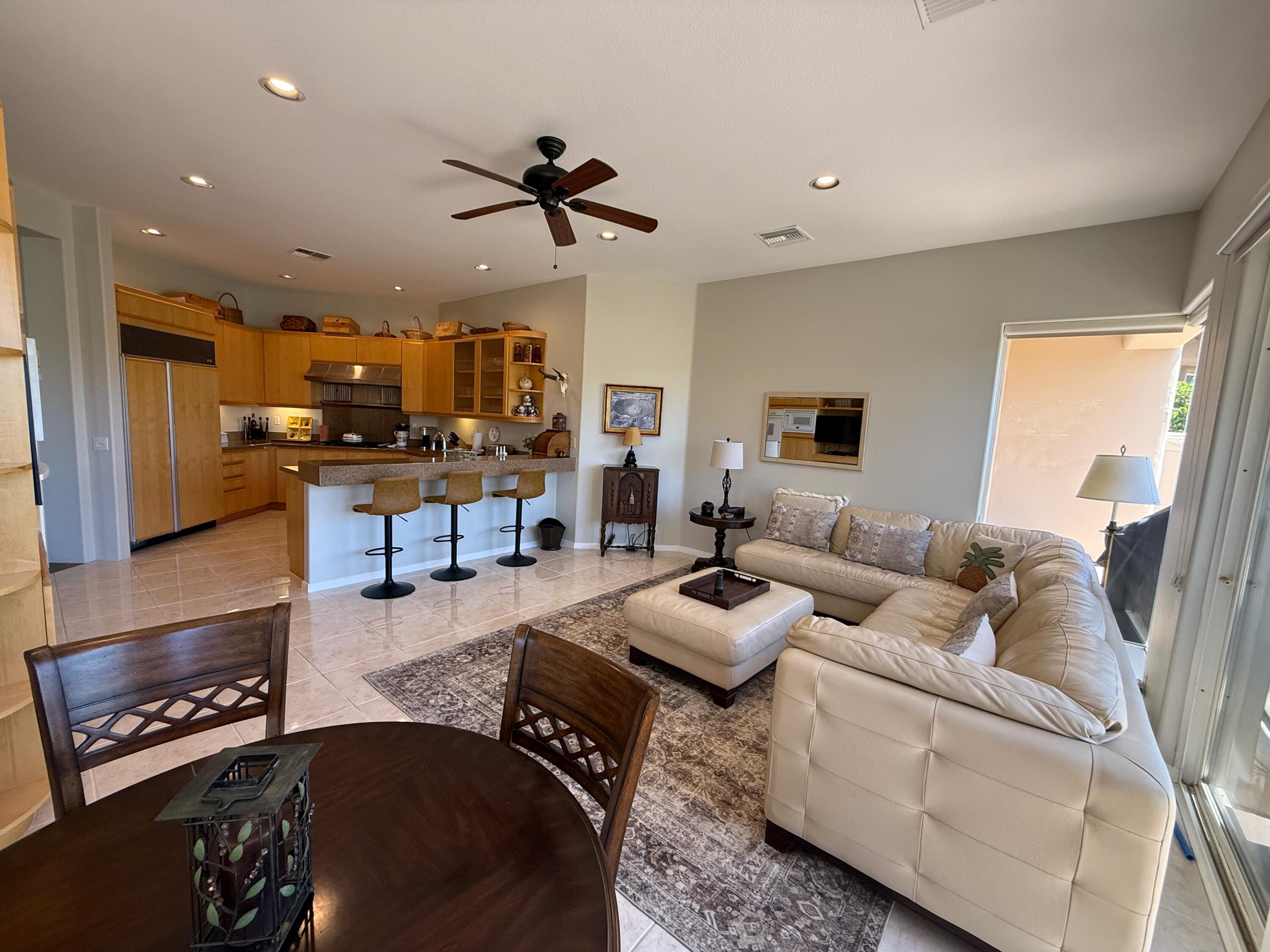 79765 Tangelo La Quinta, CA 92253 - Photo 25 of 55 a living room with furniture and a flat screen tv