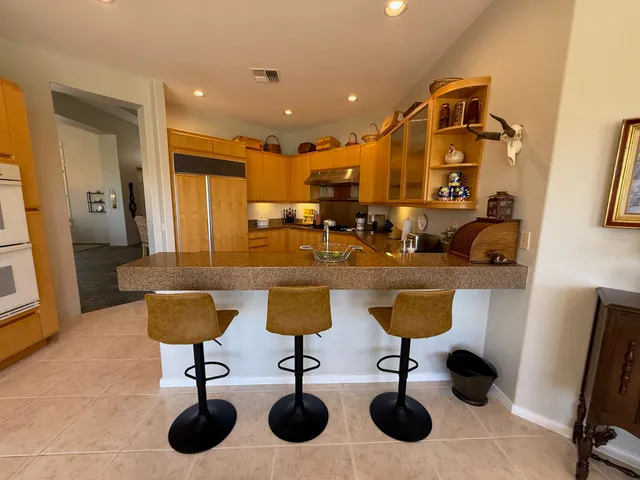 a kitchen with granite countertop cabinets and a sink