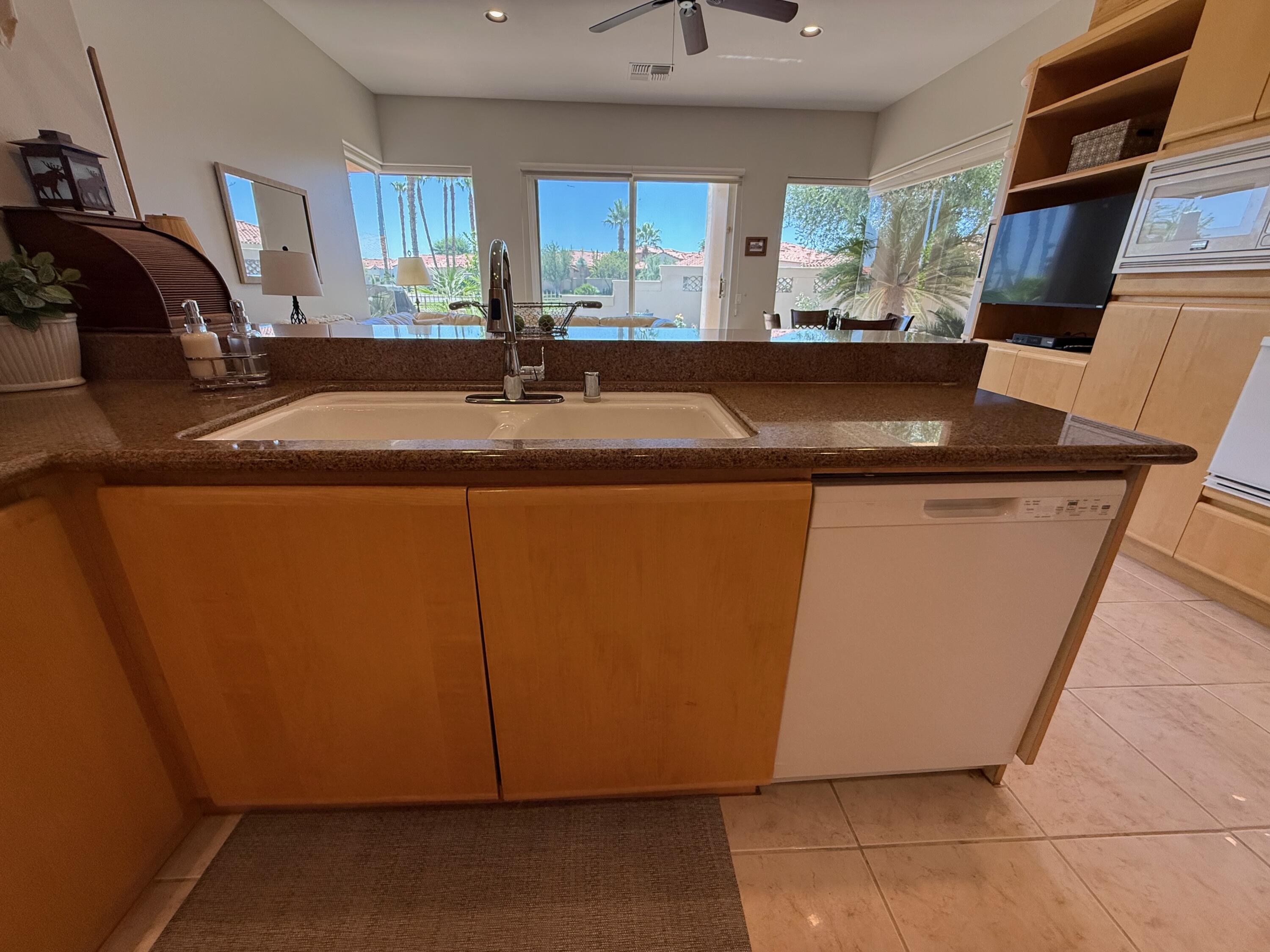 79765 Tangelo La Quinta, CA 92253 - Photo 31 of 55 a close view of sink and cabinets