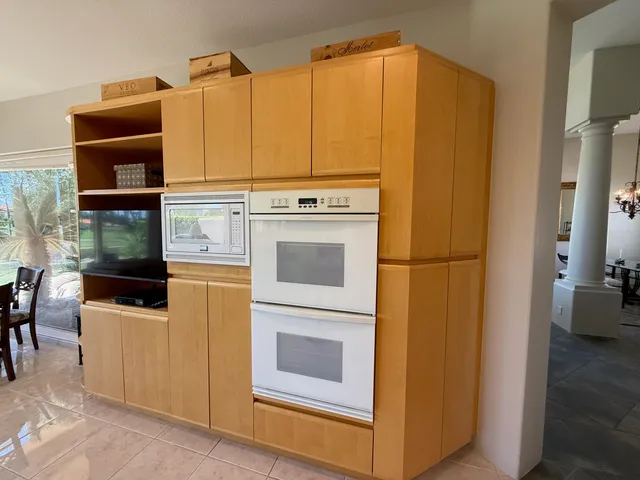 a living room with furniture and a lamp