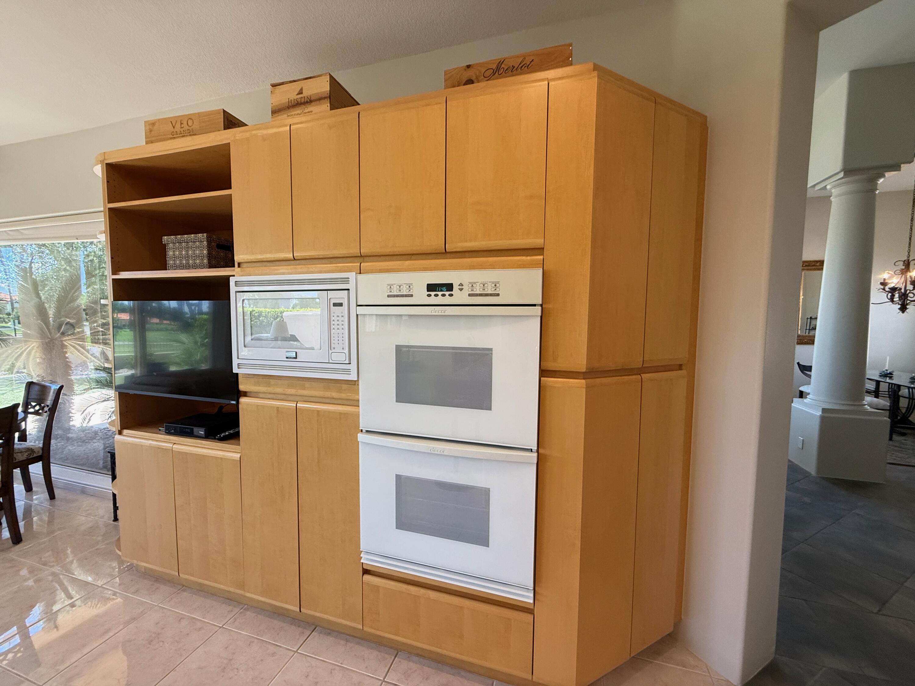 79765 Tangelo La Quinta, CA 92253 - Photo 36 of 55 a kitchen with stainless steel appliances a refrigerator and a stove top oven