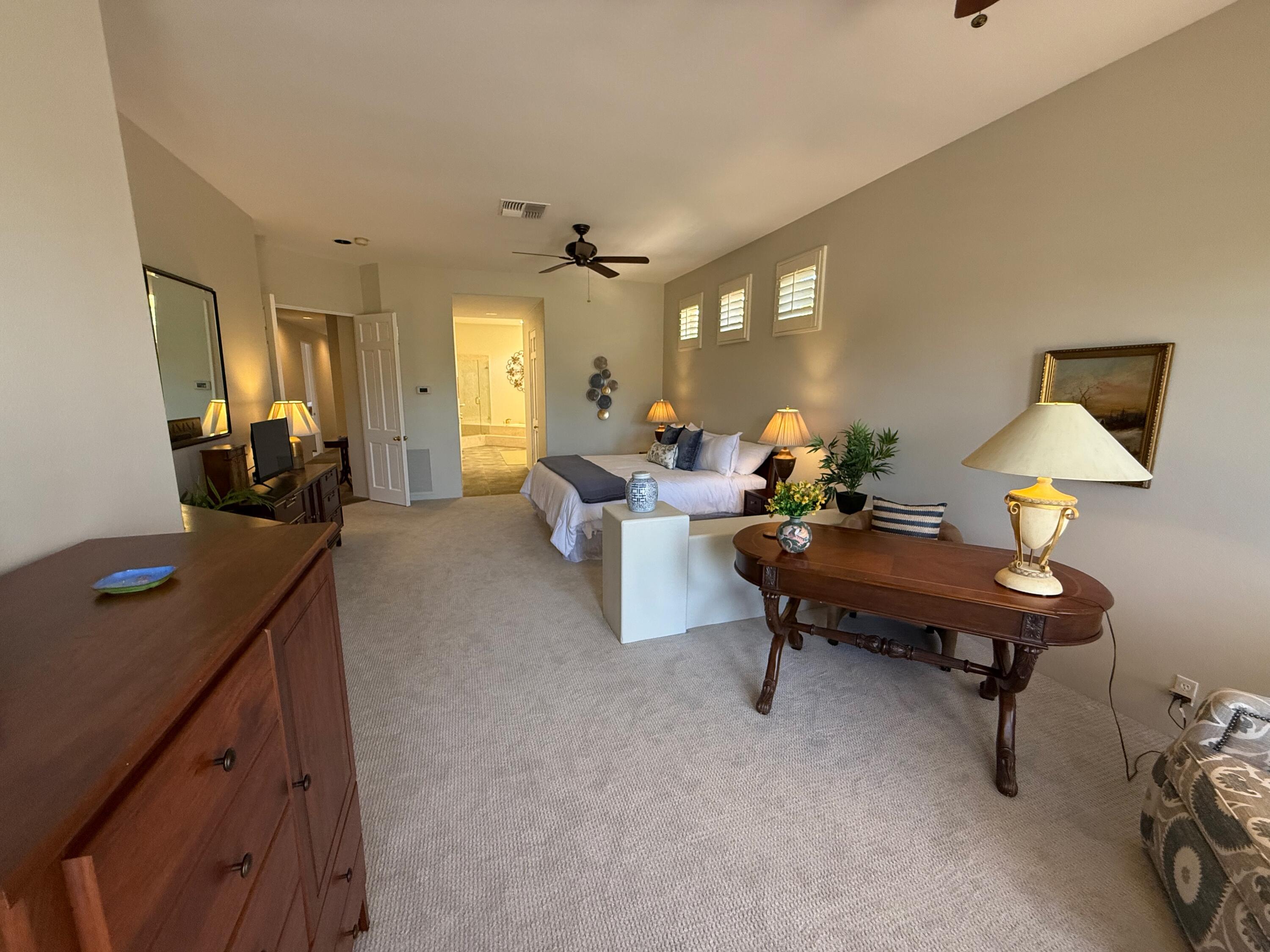 79765 Tangelo La Quinta, CA 92253 - Photo 40 of 55 a living room with furniture and a lamp