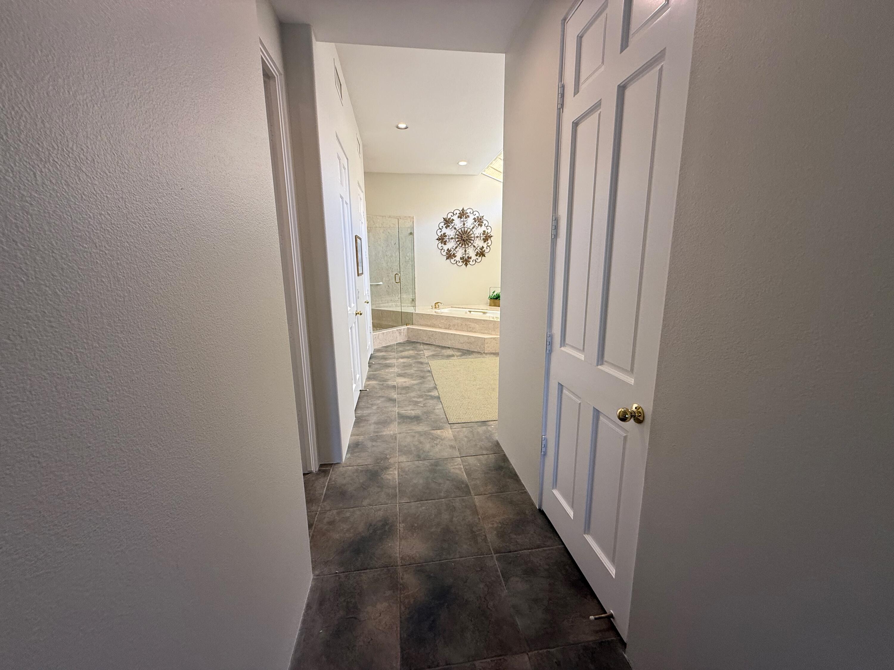 79765 Tangelo La Quinta, CA 92253 - Photo 42 of 55 a view of a hallway with a wooden door