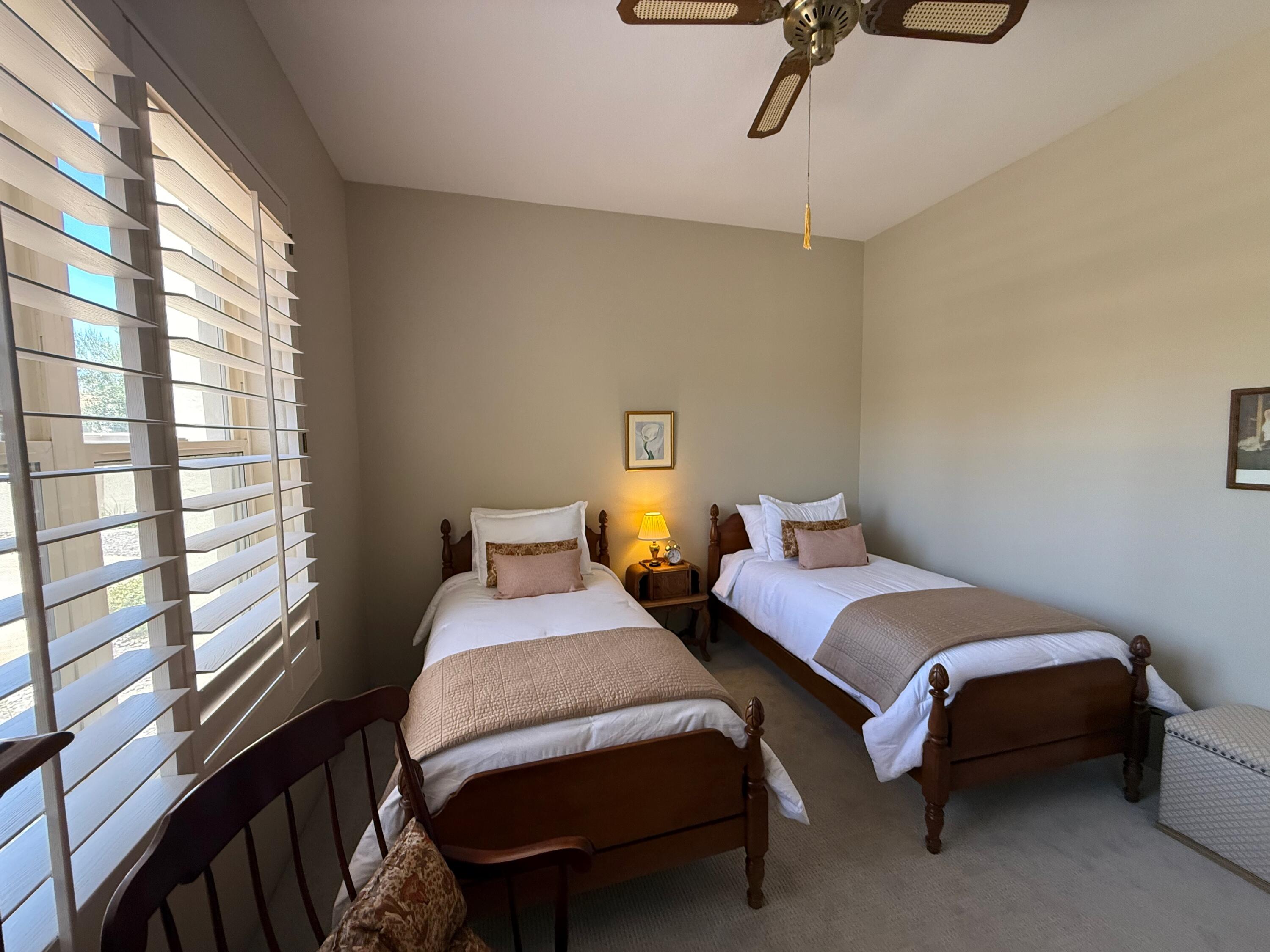 79765 Tangelo La Quinta, CA 92253 - Photo 48 of 55 a bedroom with two beds and windows