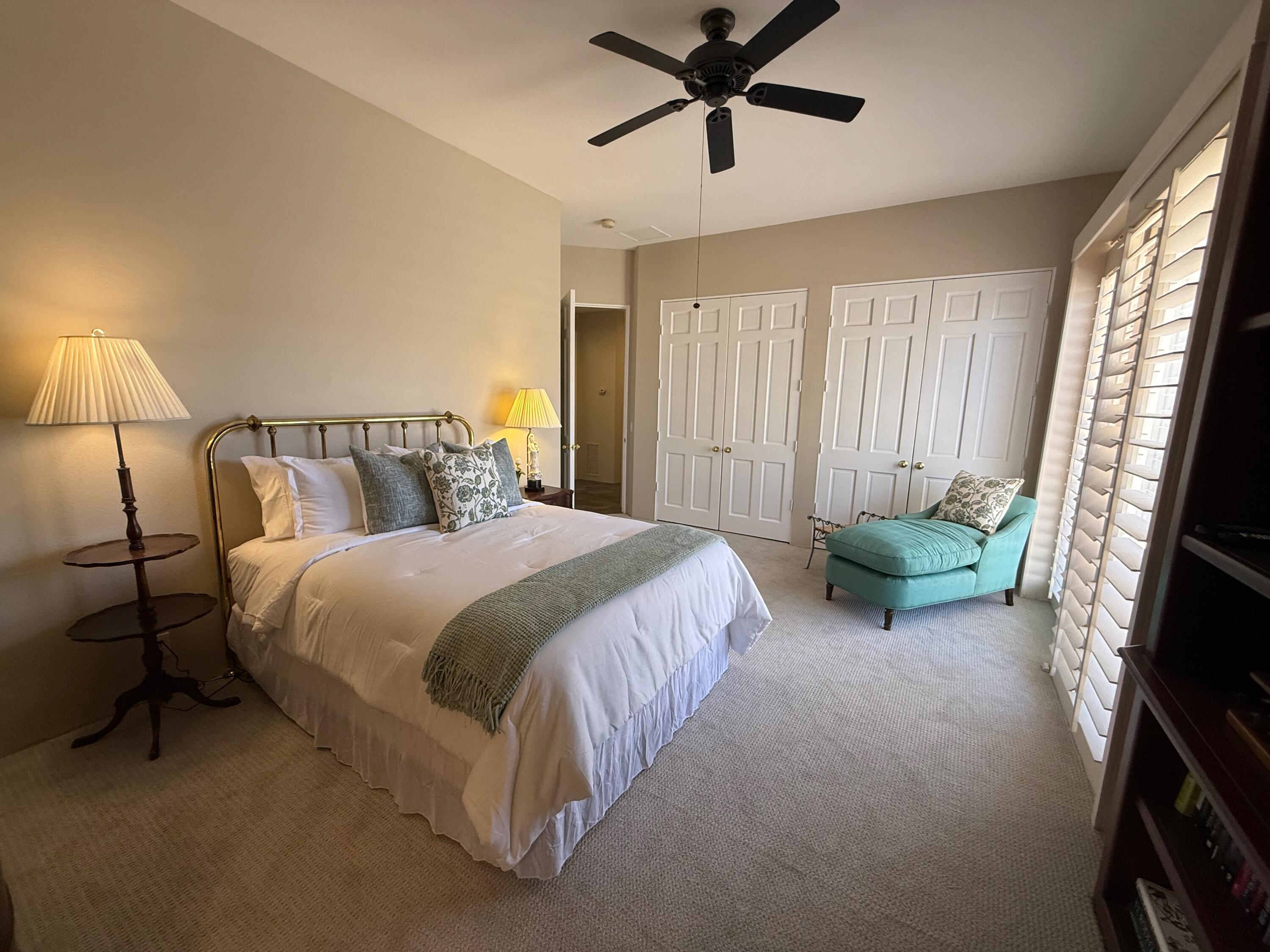 79765 Tangelo La Quinta, CA 92253 - Photo 54 of 55 a spacious bedroom with a bed and a flat screen tv