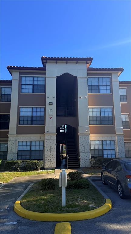 6137 Metrowest Boulevard, Unit 307 Orlando, FL 32835 - Photo 1 of 28 a view of a house with swimming pool