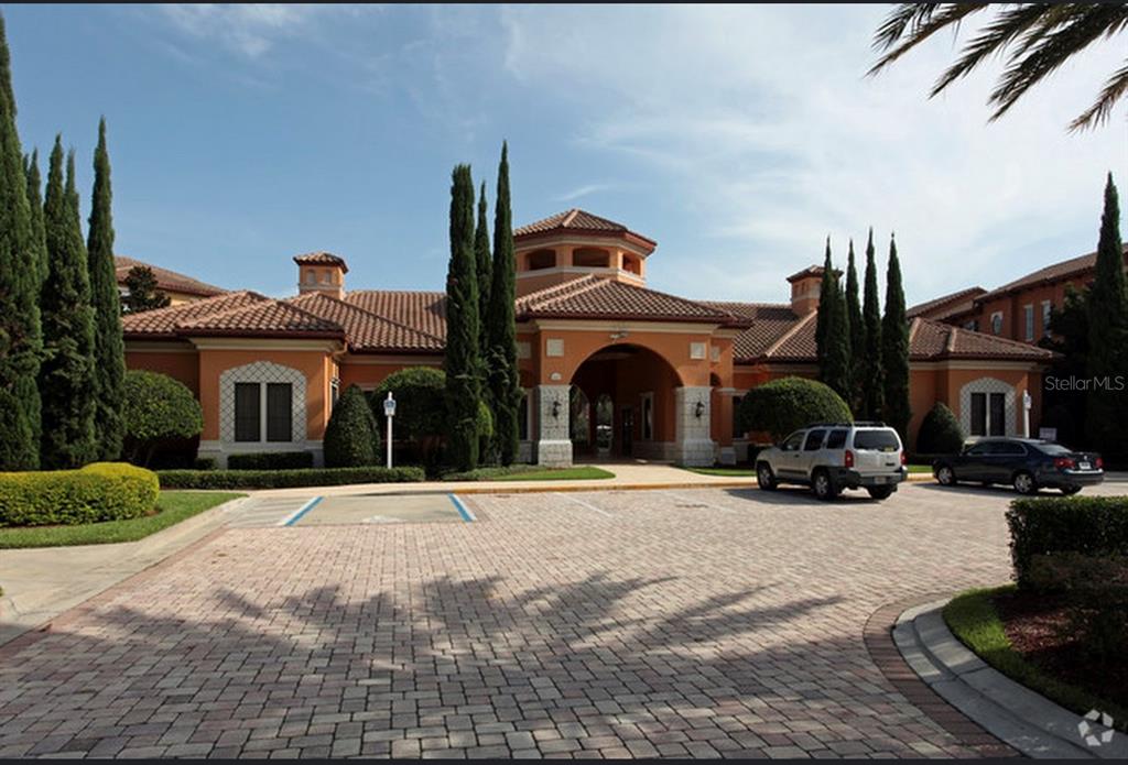6137 Metrowest Boulevard, Unit 307 Orlando, FL 32835 - Photo 19 of 28 a view of car parked in front of house