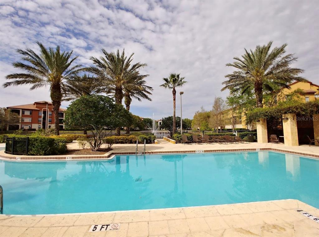 6137 Metrowest Boulevard, Unit 307 Orlando, FL 32835 - Photo 23 of 28 a view of a house with swimming pool and sitting area