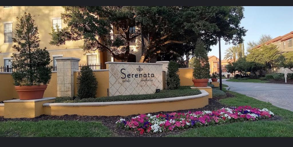 6137 Metrowest Boulevard, Unit 307 Orlando, FL 32835 - Photo 3 of 28 a sign that is sitting in front of flowers